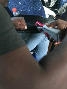 Using a handheld sewing machine